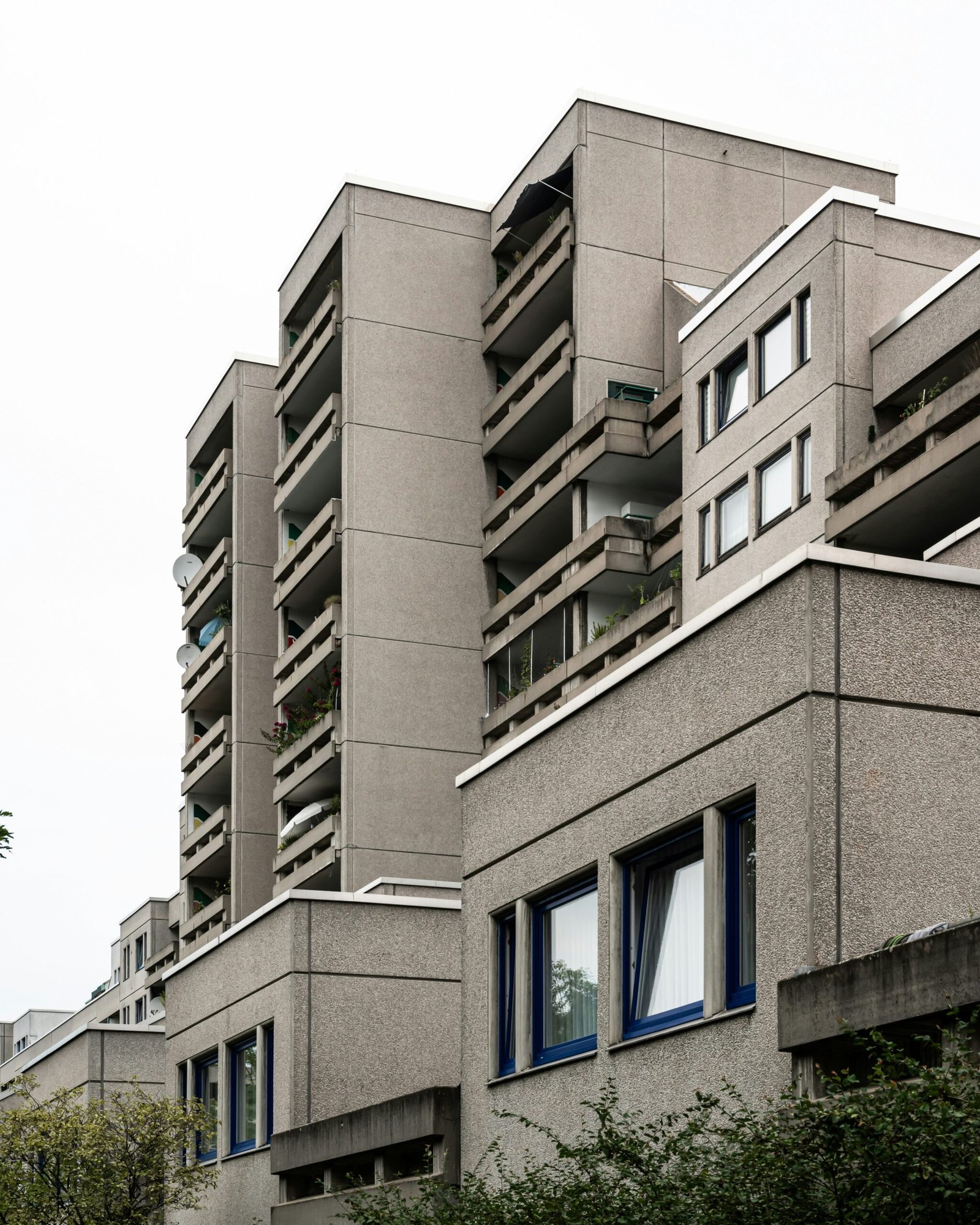 a tall building with many windows and balconies